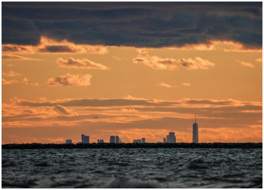 Stunning city skyline silhouette beneath a vivid s