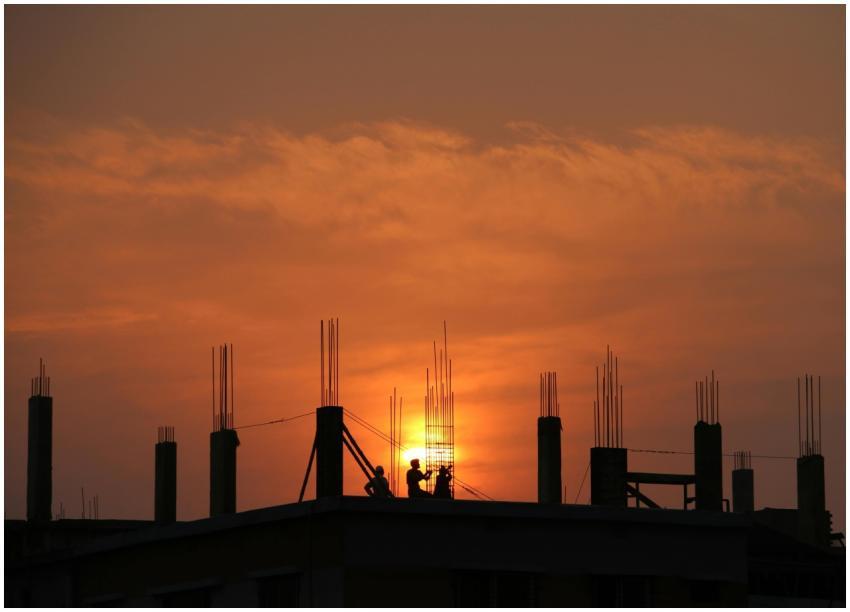 Silhouette of workers on a construction site again