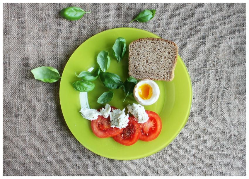 Top-down view of a breakfast plate featuring bread
