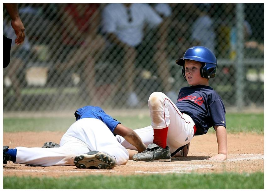 Young baseball players in action during an intense