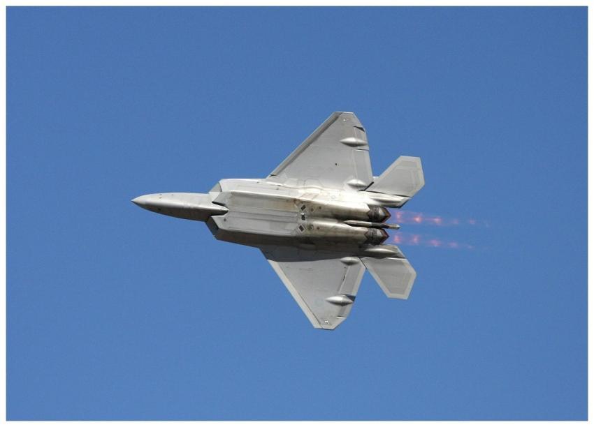 F-22 Raptor fighter jet soaring at high speed with