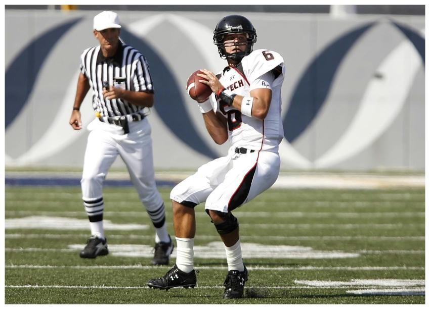 Athlete in uniform preparing to throw during an ou