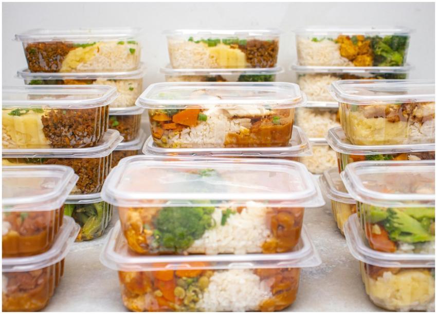 Multiple containers of prepared meals with rice an