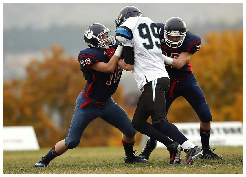 Football players in action during a competitive ga