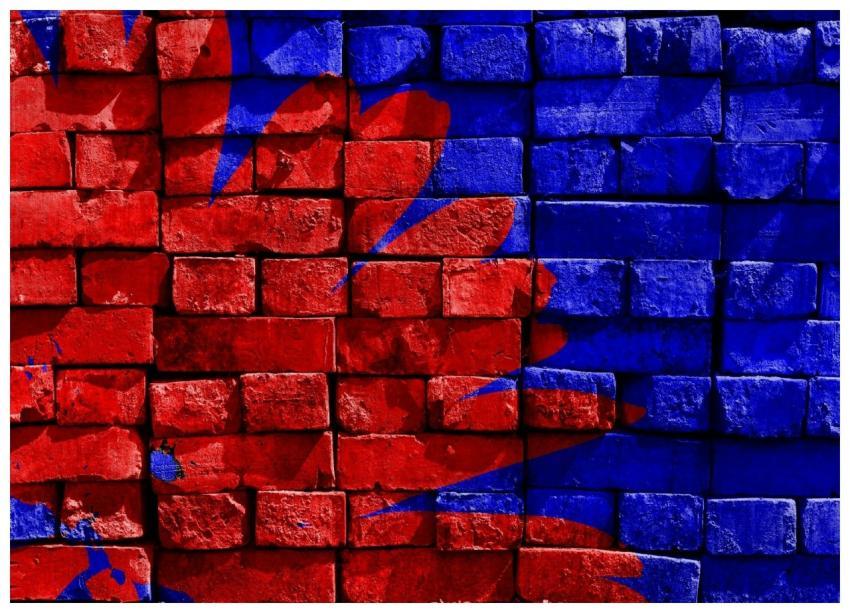 Vibrant red and blue graffiti art on a textured br