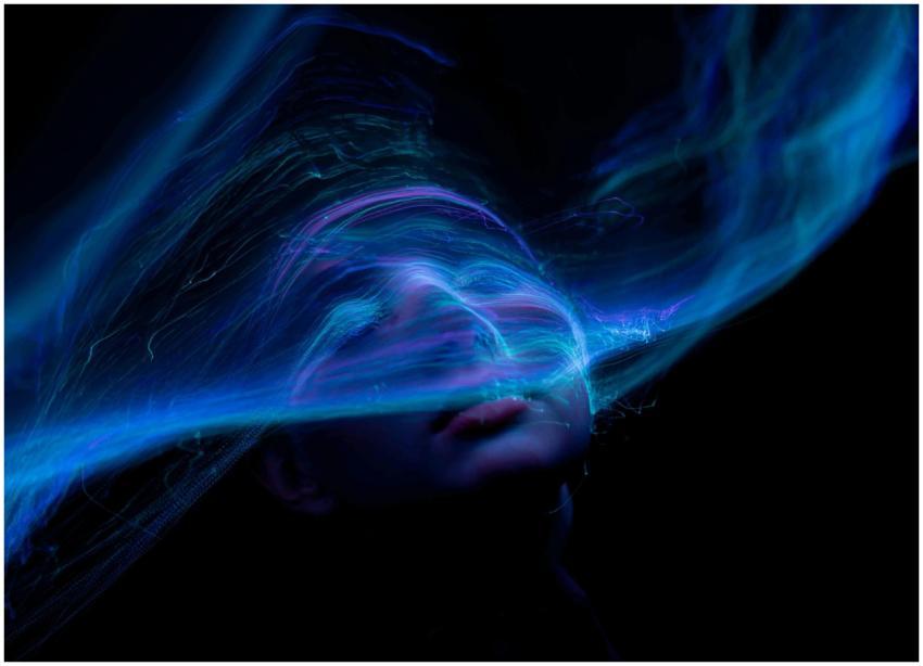 Dynamic portrait with swirling neon lights creatin