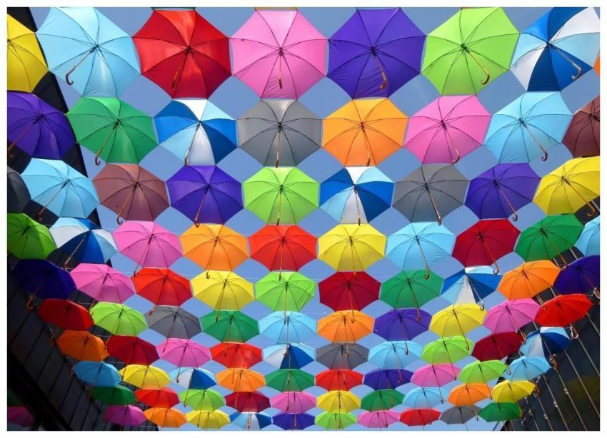 Bright and colorful arrangement of umbrellas creat
