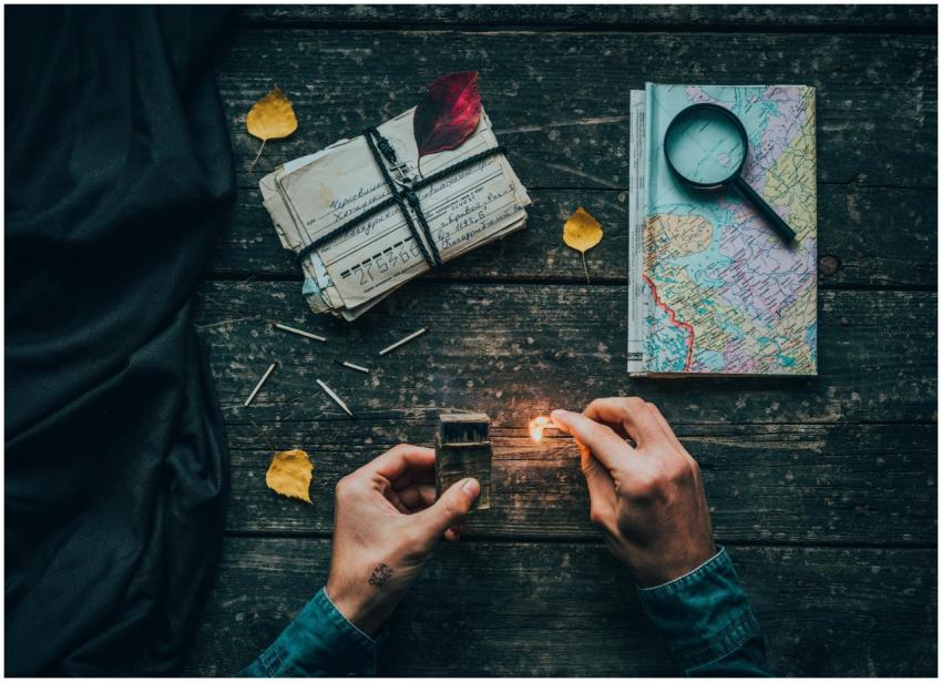 A creative flat lay featuring a map, letters, and