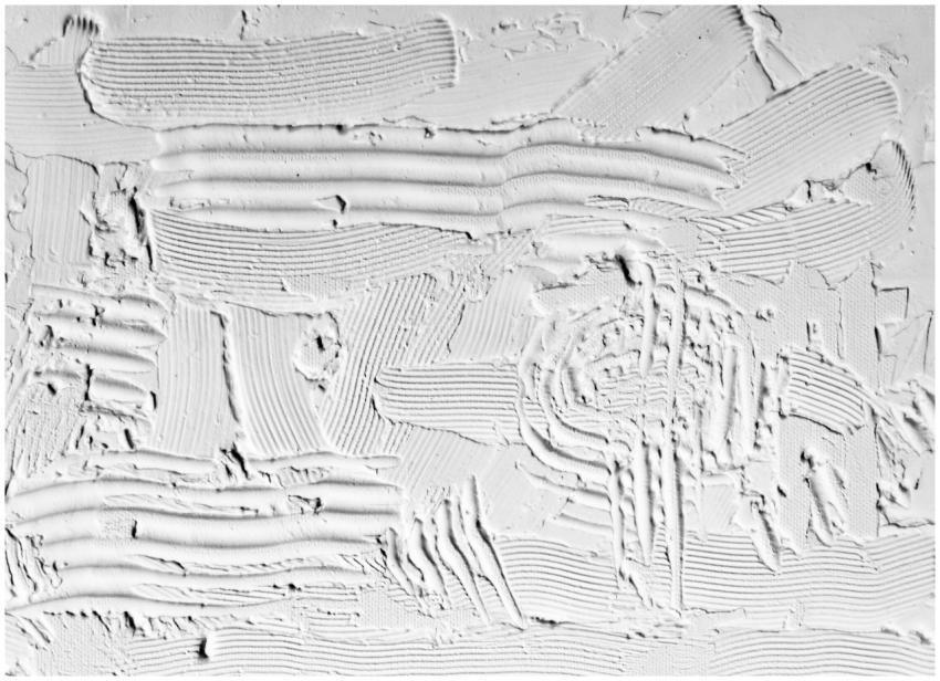 Close-up of textured white plaster with artistic s