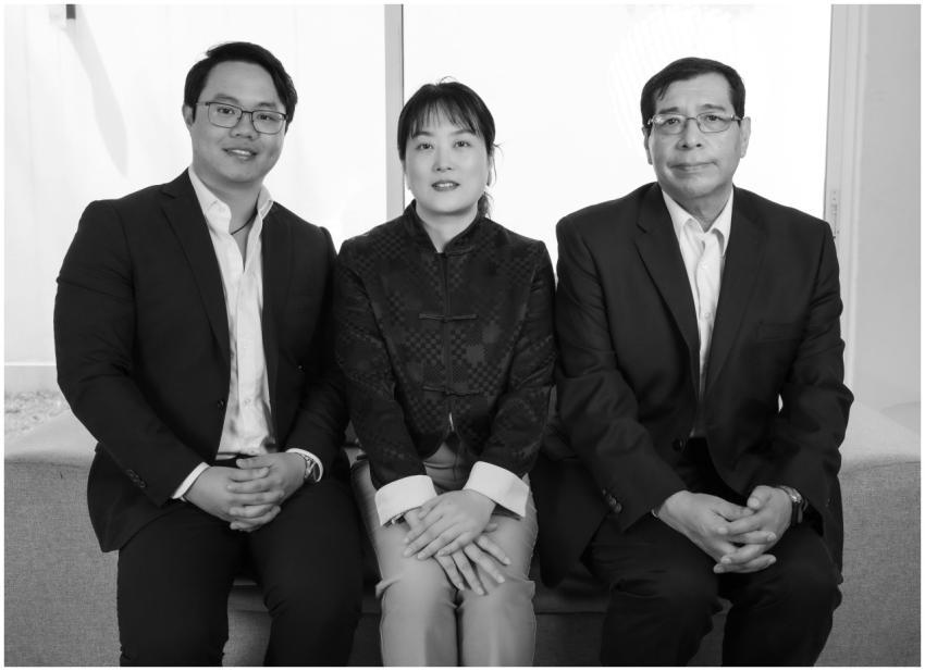 Black and white portrait of three professionals in