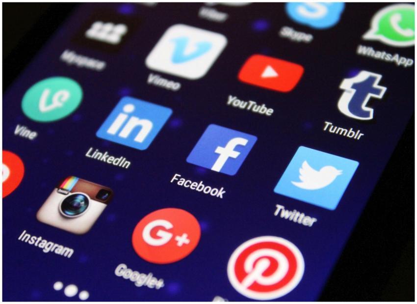 Close-up of a smartphone screen showing various so