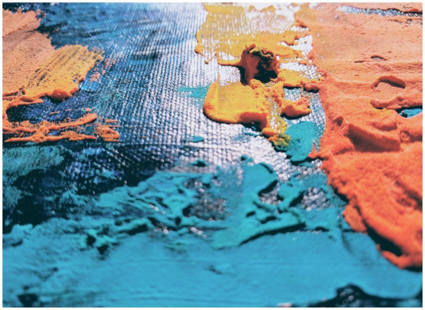 Close-up view of vibrant colored paints on a surfa