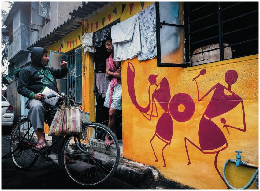 Vibrant street scene in Kolkata with a cyclist and