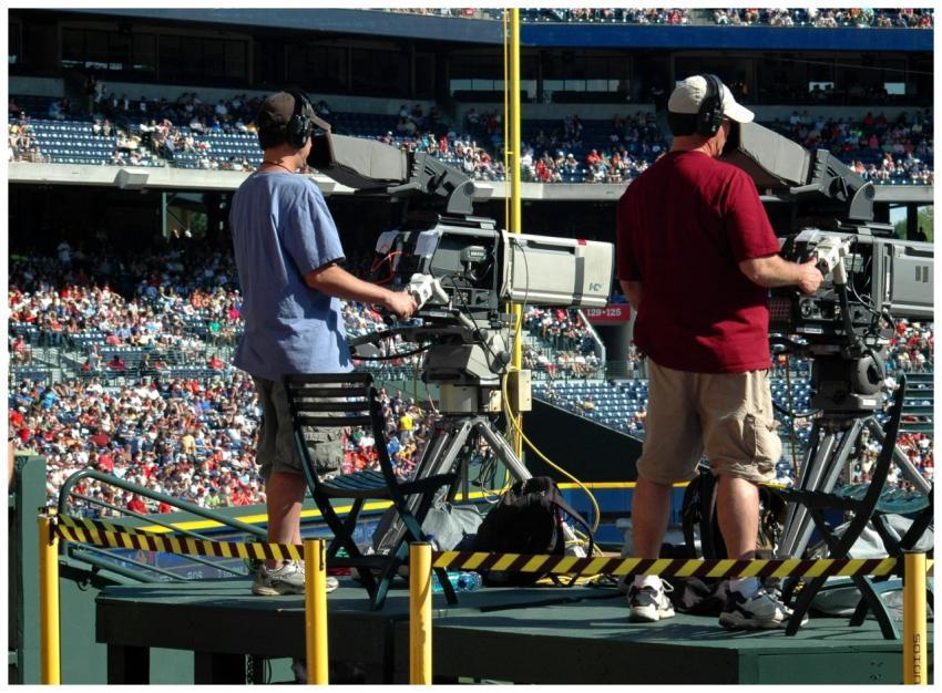 Camera operators capturing a live sports event at
