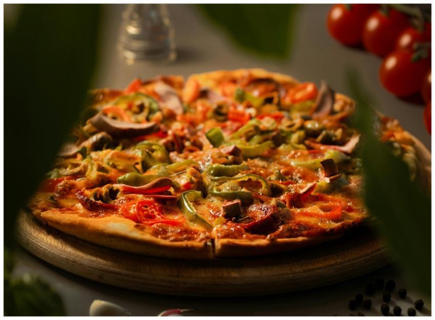 Close-up image of a vegetarian pizza topped with b