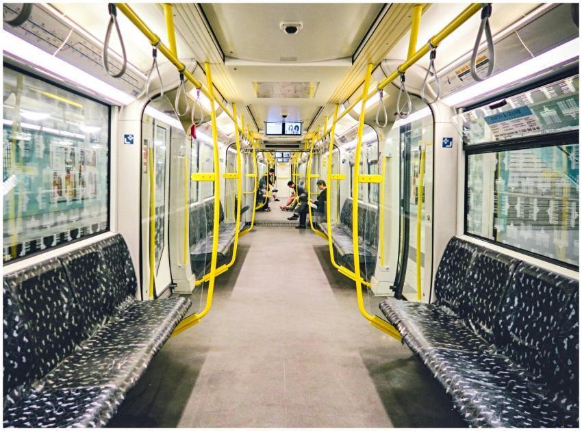Spacious interior of a Berlin subway car with yell