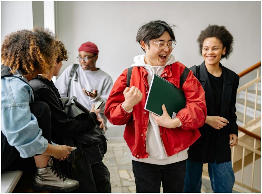 A group of diverse college students happily intera