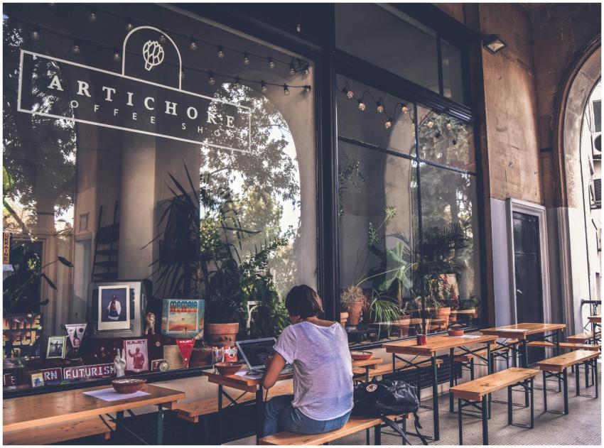 Atmospheric exterior view of a cozy cafe with wood
