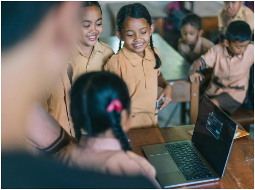 Smiling children engaged in a group learning activ