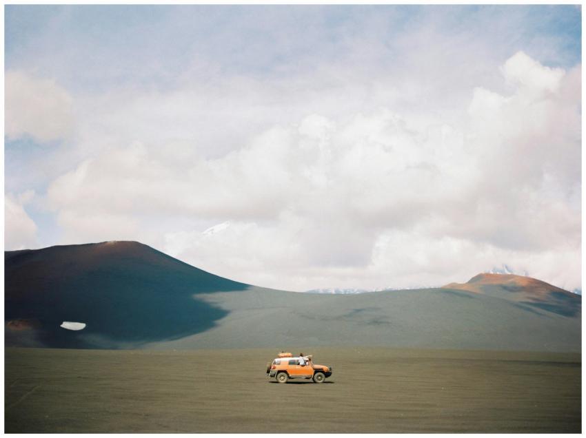 A lone SUV exploring the remote landscapes of Kamc