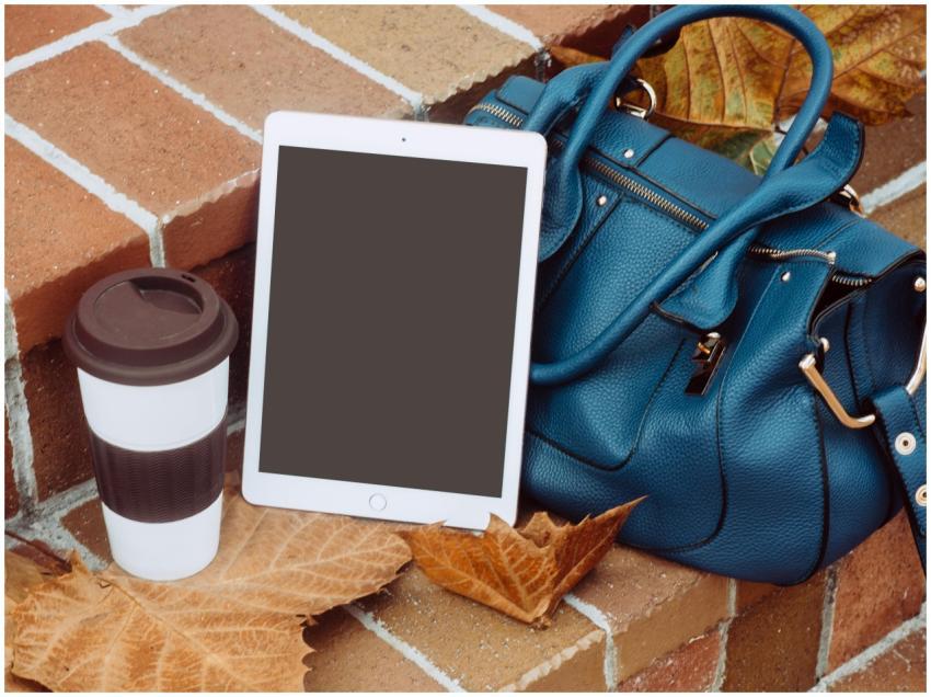A stylish autumn still life with a coffee cup, tab