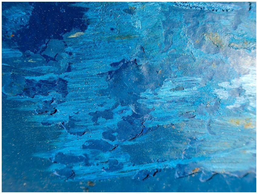 Dynamic blue abstract painting featuring textured