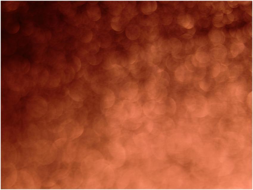 A blurred abstract orange bokeh pattern ideal for