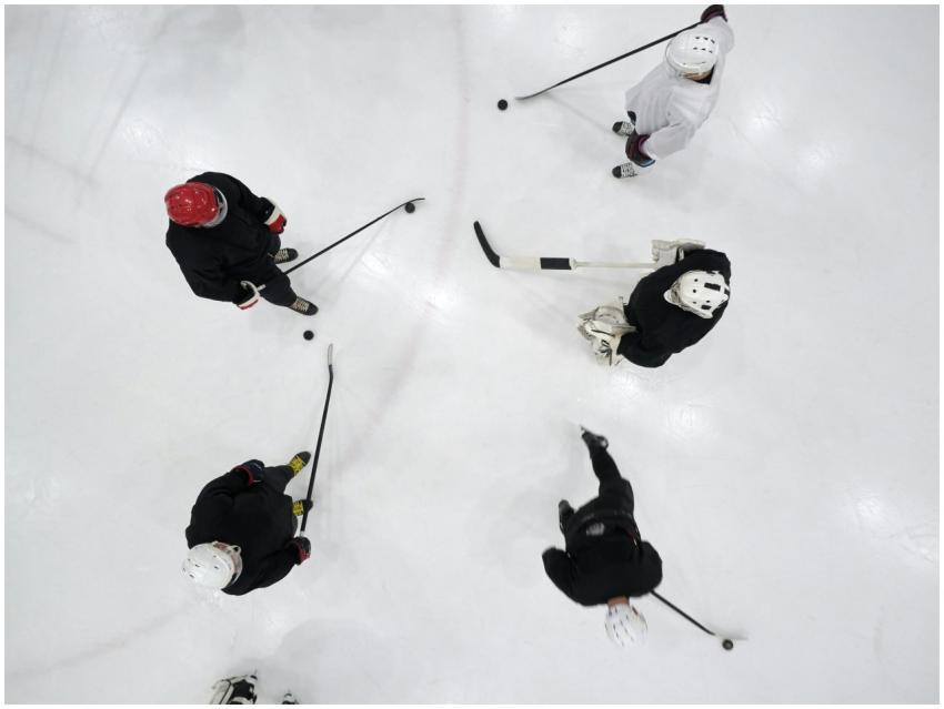 Top view of hockey players practicing on an indoor