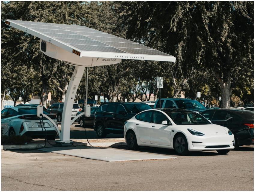 Electric car parked at a solar charging station ou