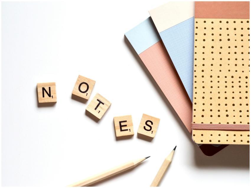 Flat lay of stationery items and Scrabble tiles sp