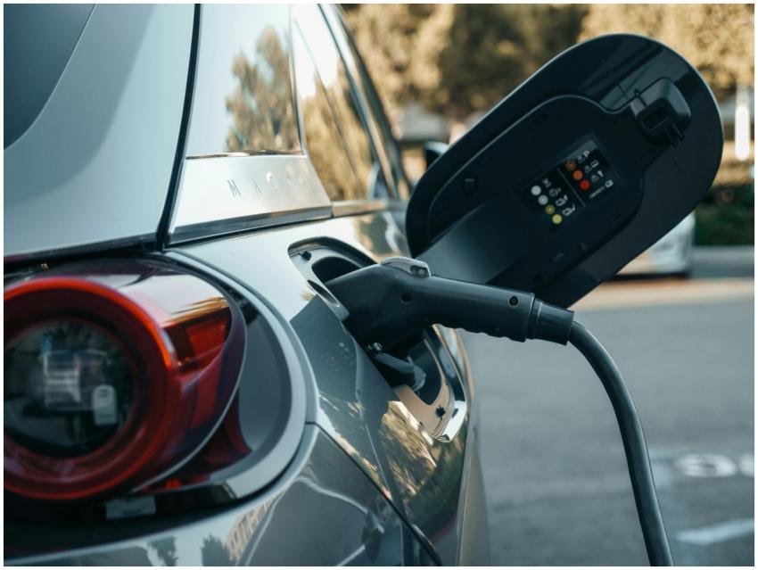 Close-up of an electric vehicle being charged, hig