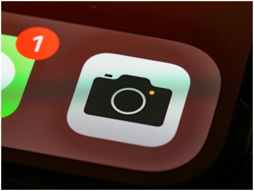 Detailed view of a smartphone camera app icon with