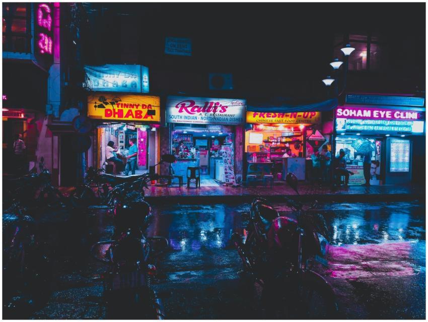 Colorful street scene in Kolkata with glowing shop