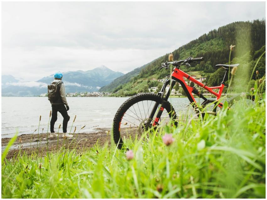 Cyclist overlooking Zell am See in Salzburg, Austr