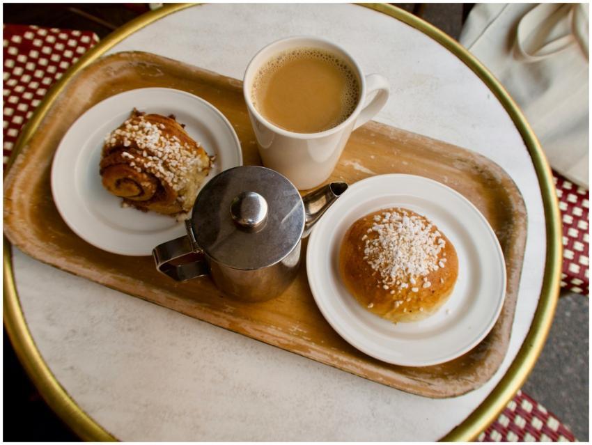 Enjoy a warm cup of coffee with cinnamon roll and