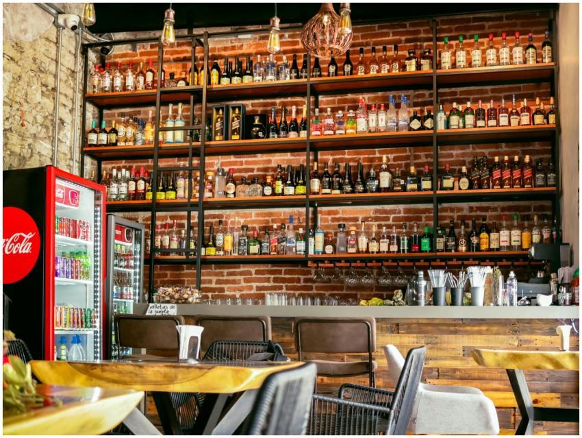 Cozy restaurant bar with industrial design and div