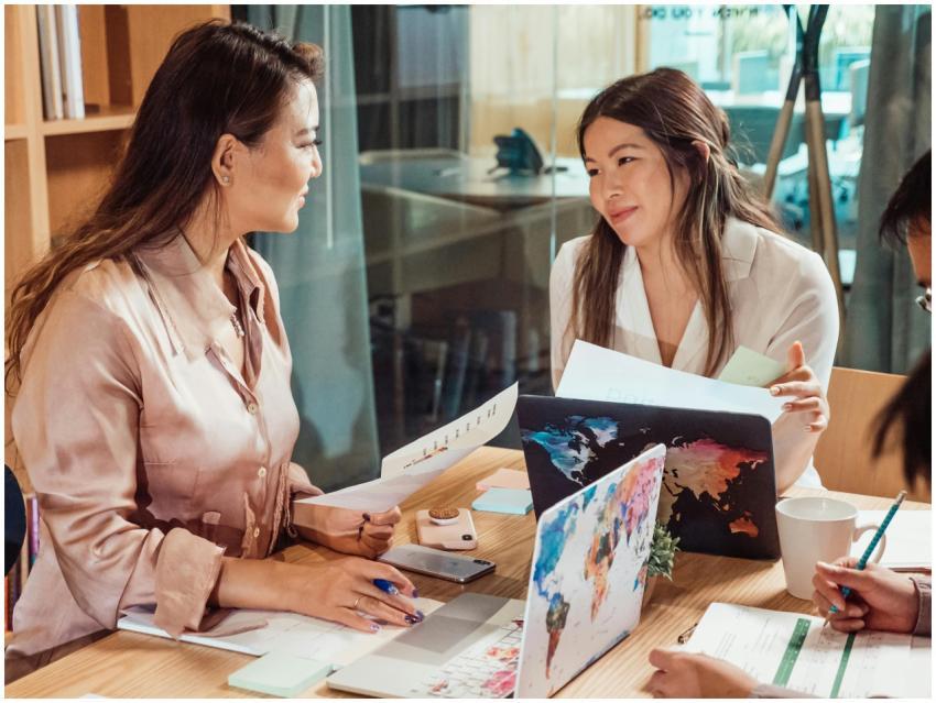Group of colleagues discussing strategy in a moder