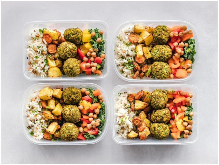 Colorful meal prep containers with falafel, chickp