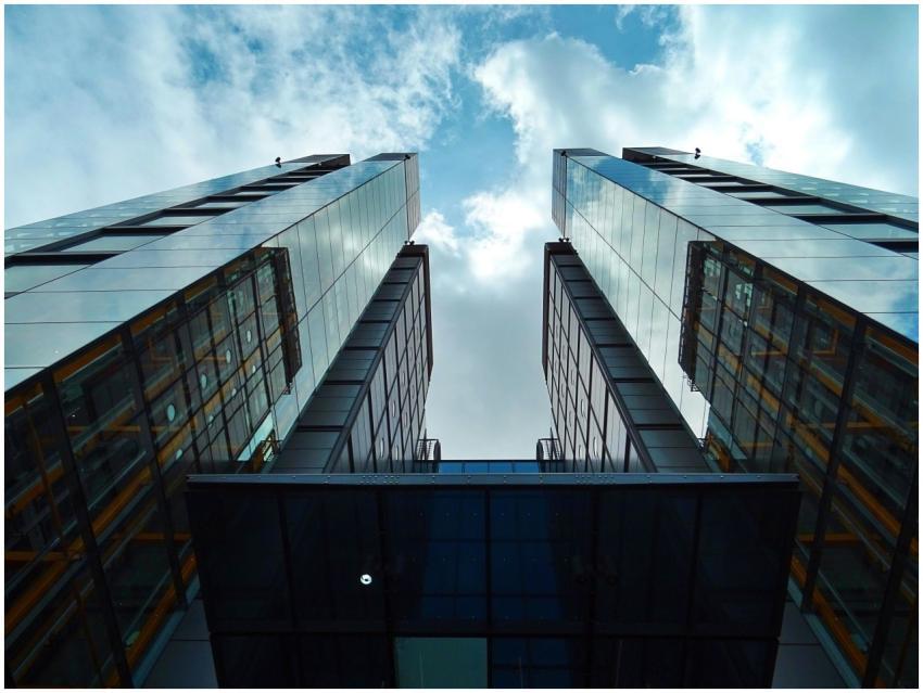 Low-angle view of sleek, modern skyscrapers with g