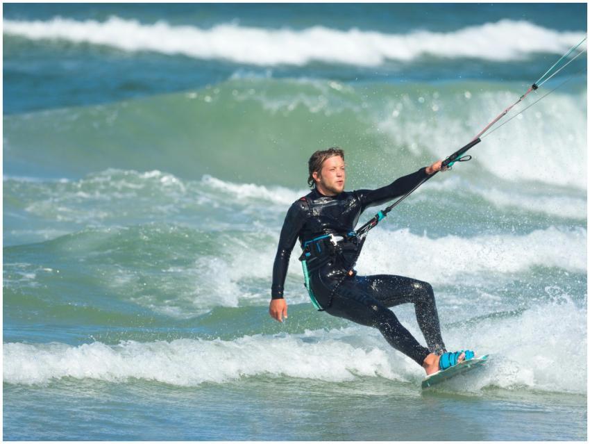 Exciting kitesurfing action with a man riding the