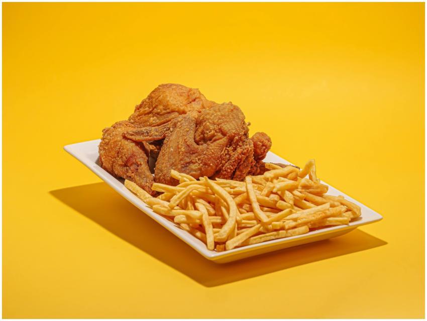 Delicious fried chicken and crispy fries on a vibr