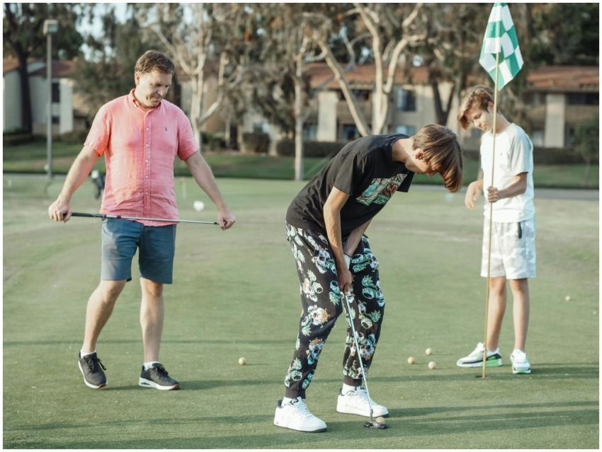 Group of three friends enjoying a casual golf game