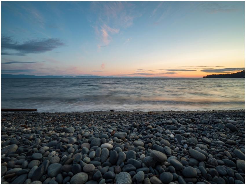 A tranquil scene of a pebble beach on Vancouver Is