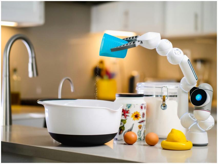 A robotic arm carefully pouring ingredients into a