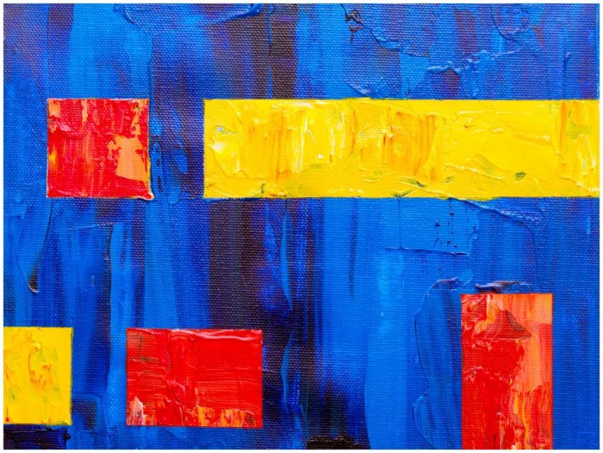 Colorful abstract art on canvas featuring red and