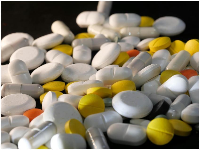 A close-up shot of various capsules and tablets, i