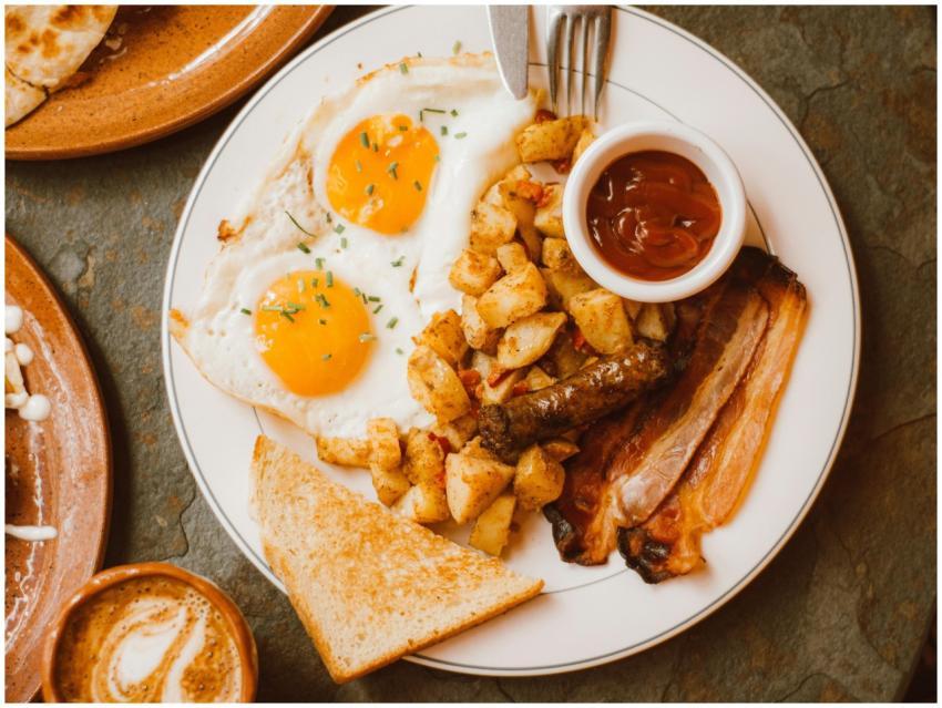 Delicious breakfast plate with sunny side up eggs,