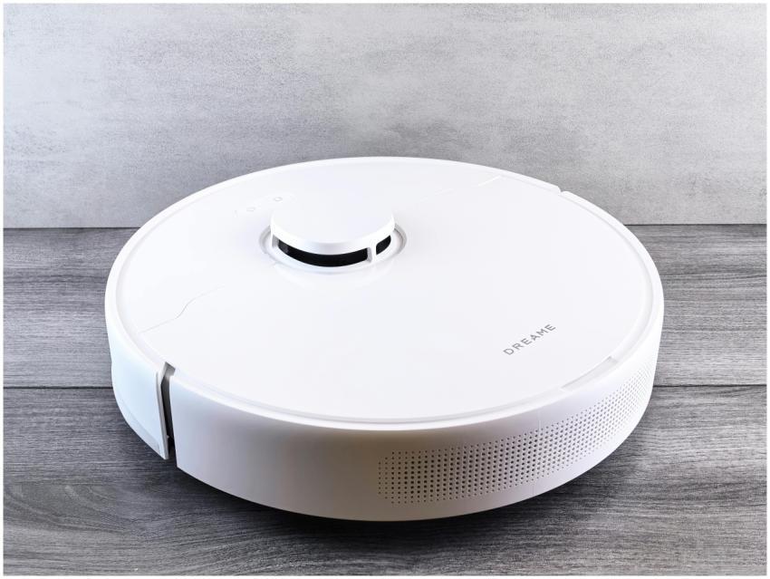 Sleek white robot vacuum cleaner on a wooden floor