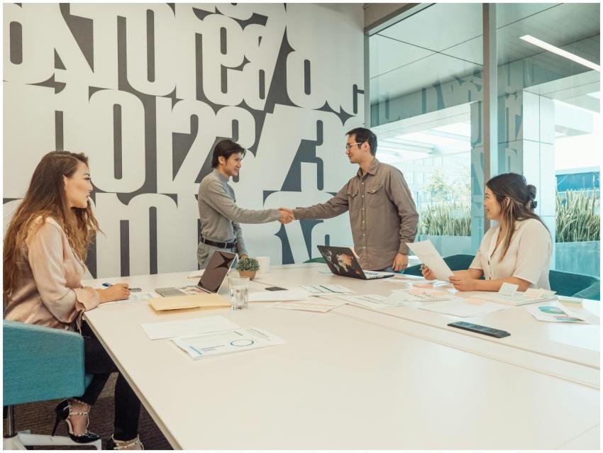 A diverse team of professionals discussing and col