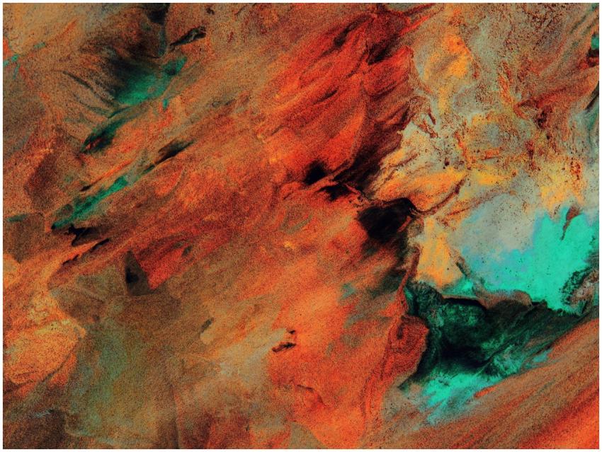 Dynamic abstract artwork featuring vivid red and t